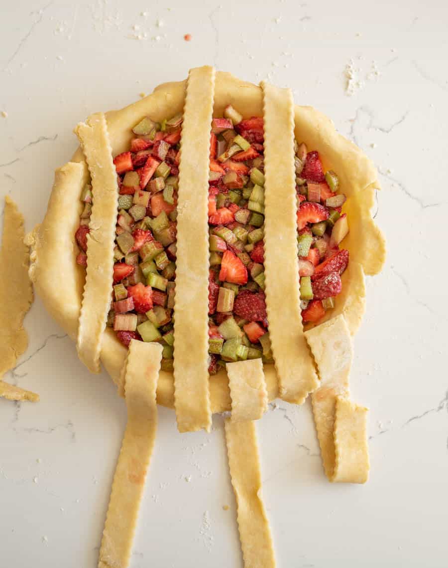 Three pie crust strips folded back.