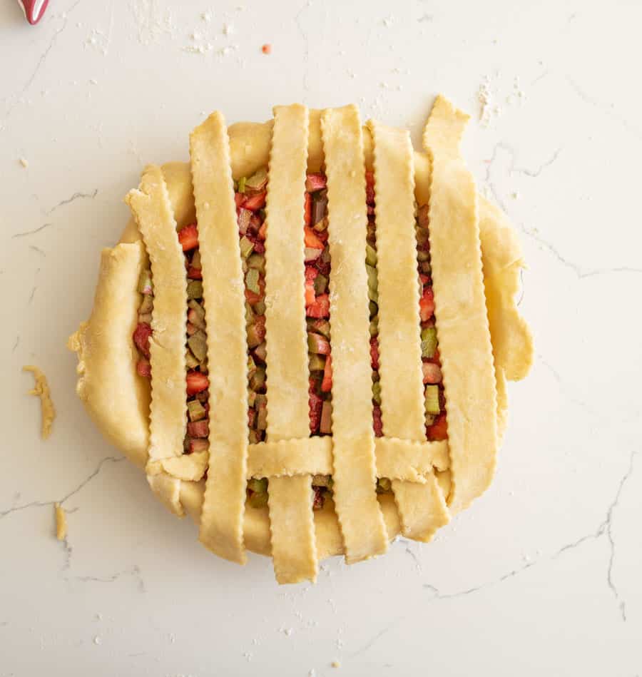 All pie crust strips folded down to rest on top of the pie.