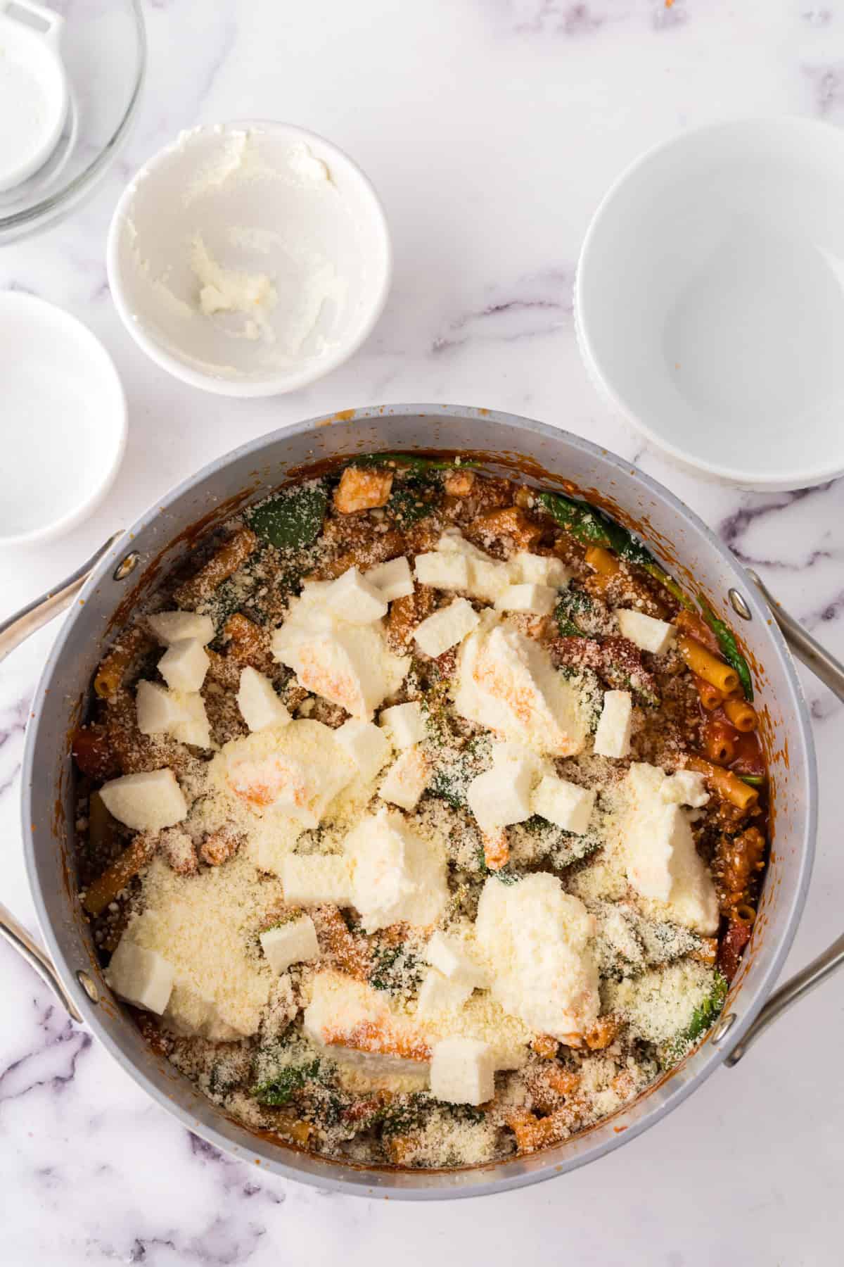 pan cooking in the process of making one pot baked ziti recipe.