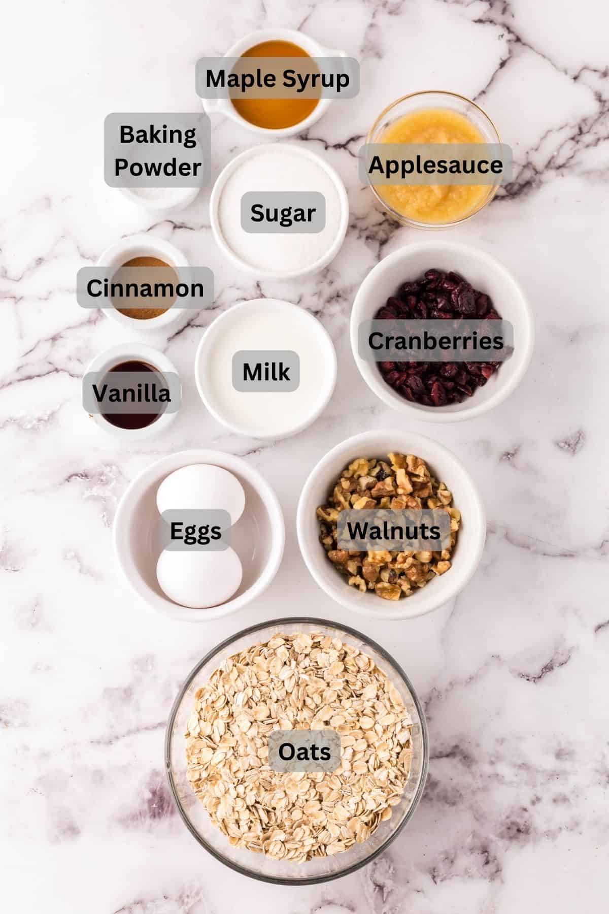 portion bowls each with digitally labeled raw ingredients to make Breakfast Bars Recipe.