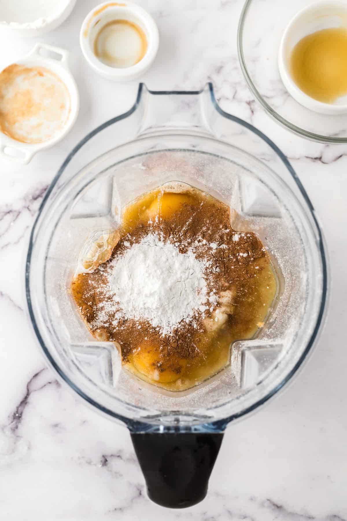 Flour, eggs and vanilla added to a blender.