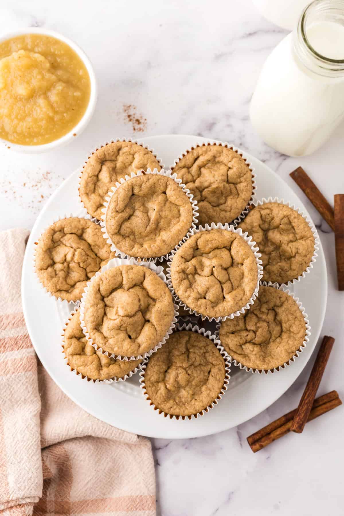 white plate with a lot of muffins on it.