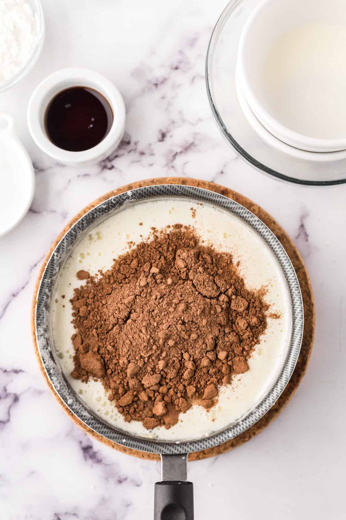 sauce pan in the process of making chocolate truffle ice cream.