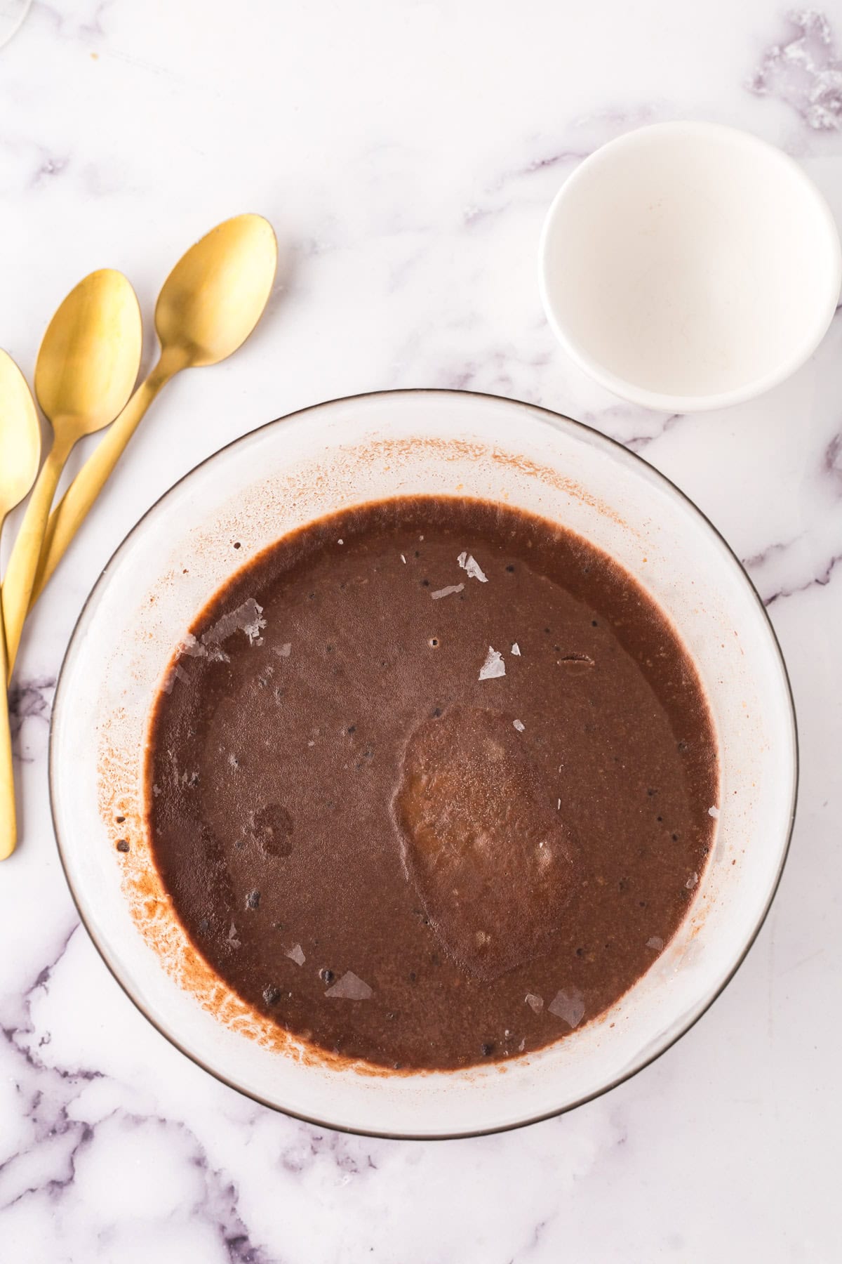 mixing bowl in the process of making chocolate truffle ice cream.