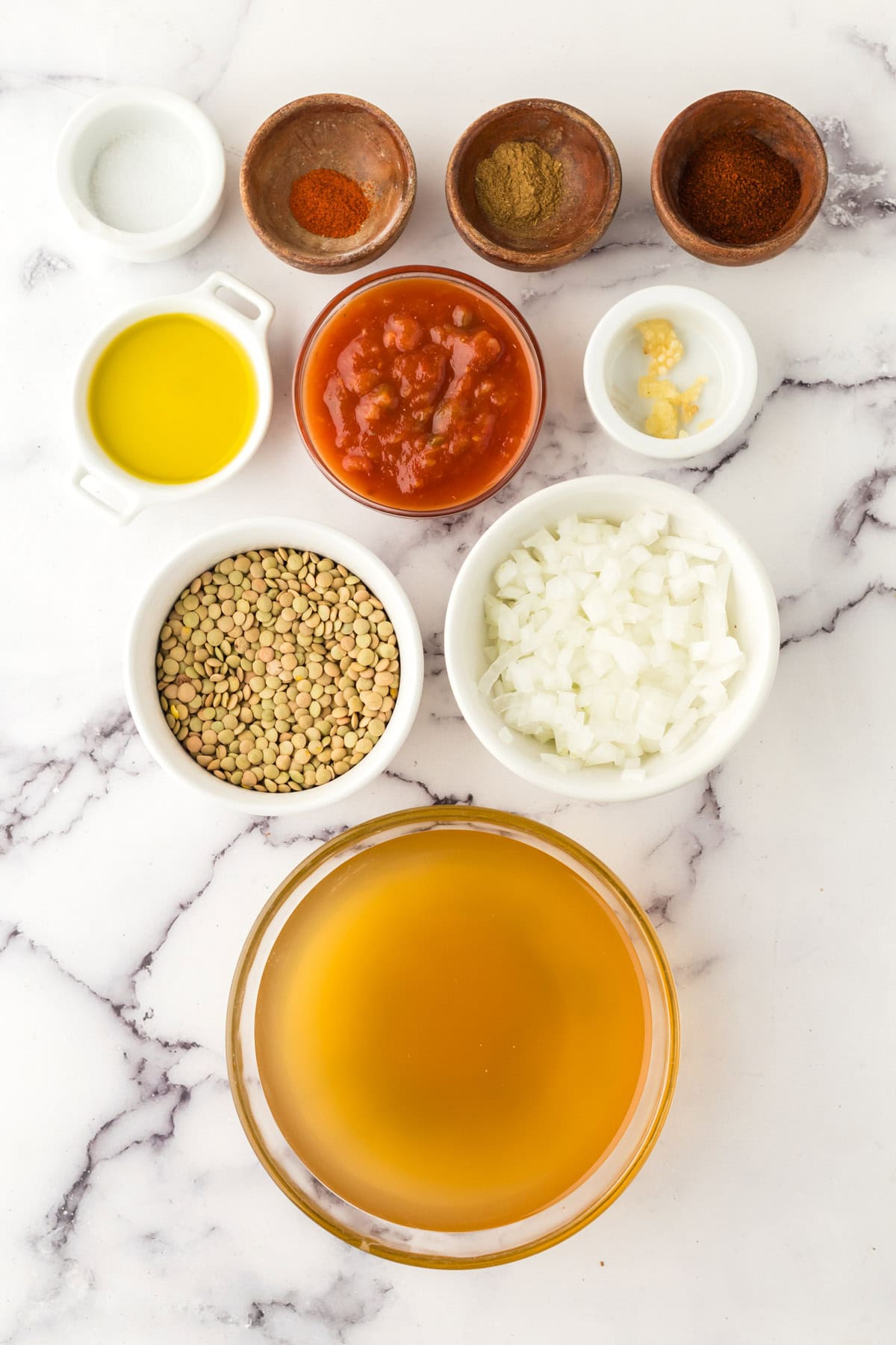 portion bowls each with raw ingredients to make easy lentil taco recipe.