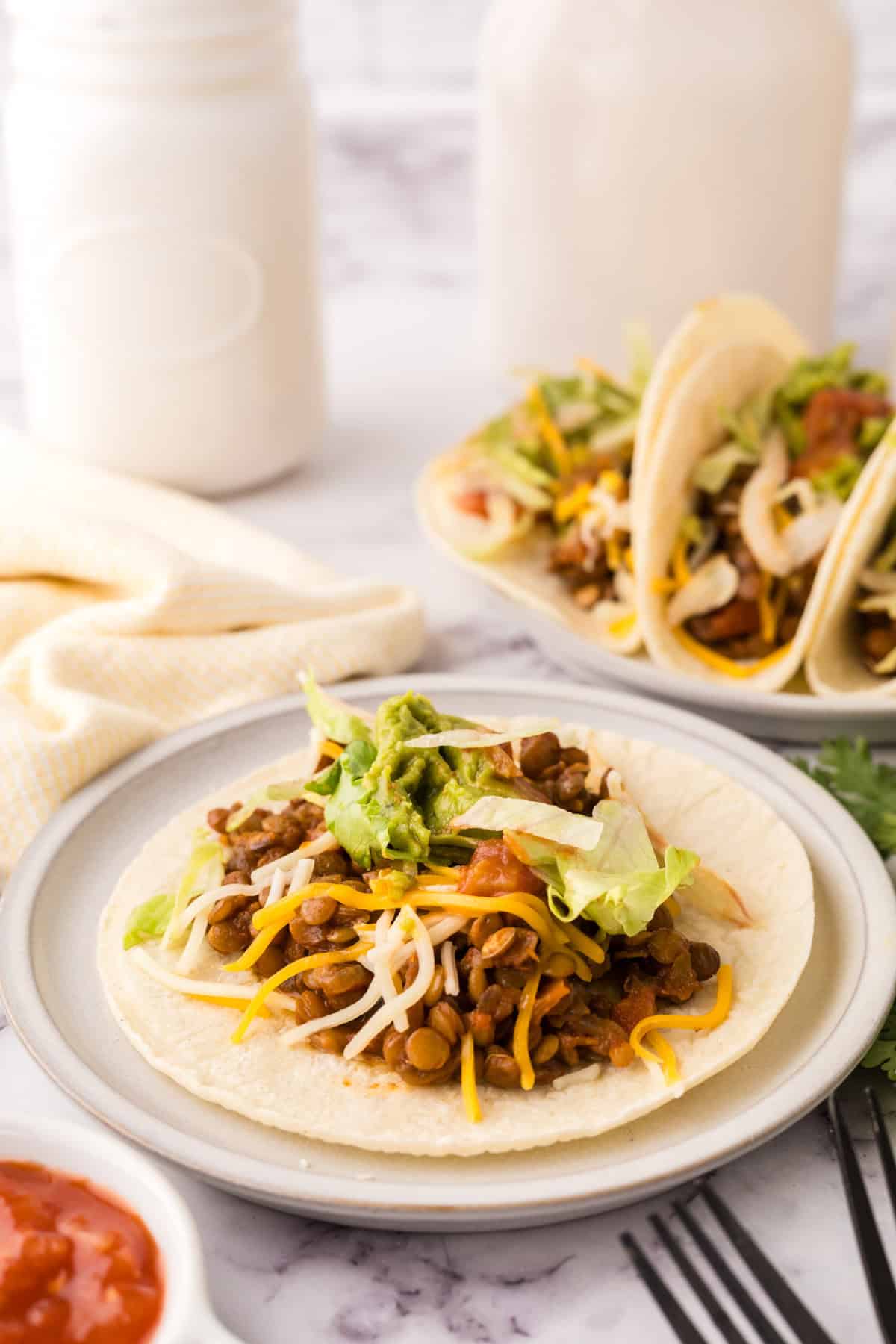 open tortilla with lentil tacos inside.