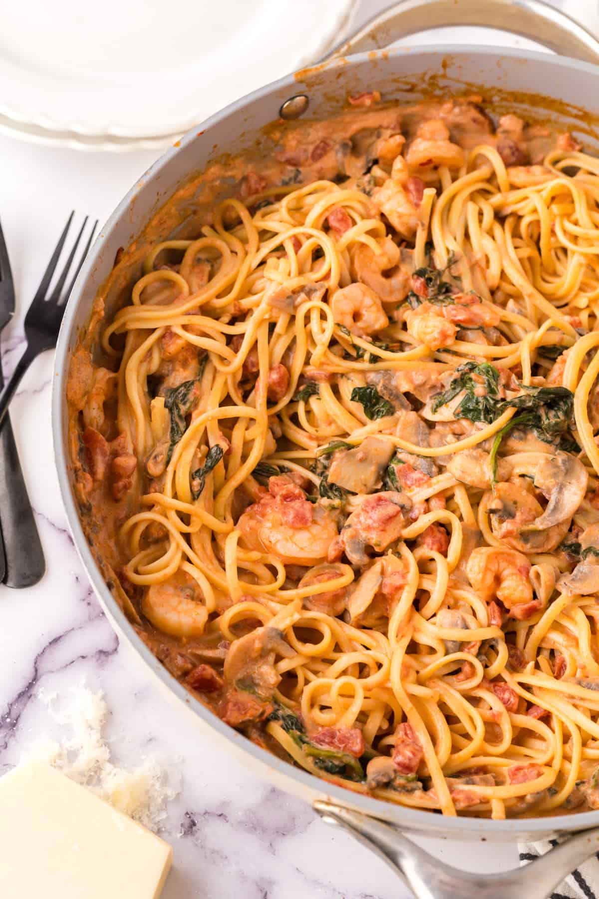linguini rosa with shrimp in a large pot.