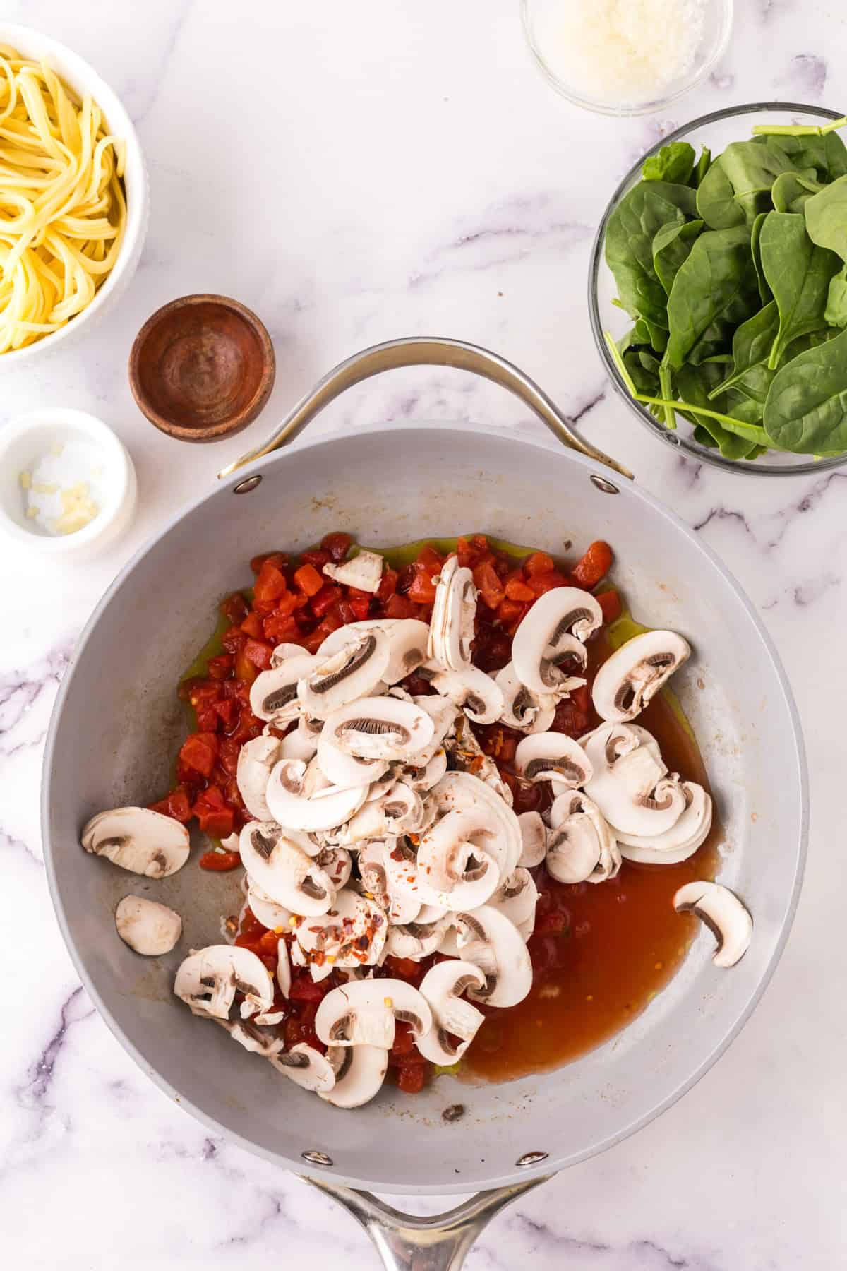 linguini rosa with shrimp in a large pot in progress.