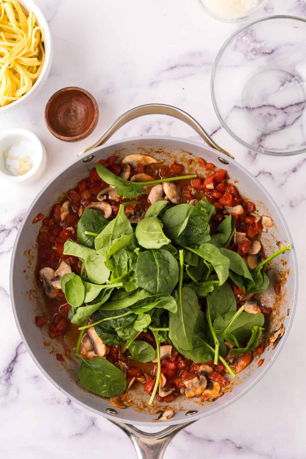 linguini rosa with shrimp in a large pot in progress.