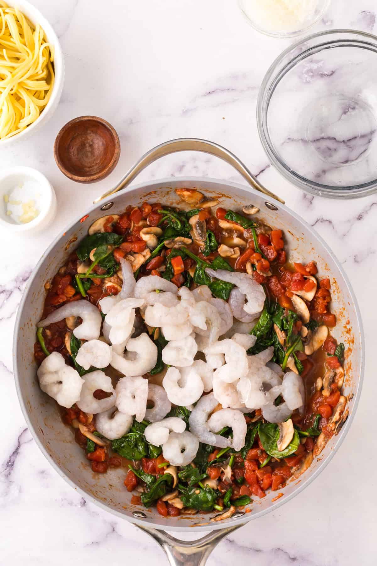 linguini rosa with shrimp in a large pot in progress.