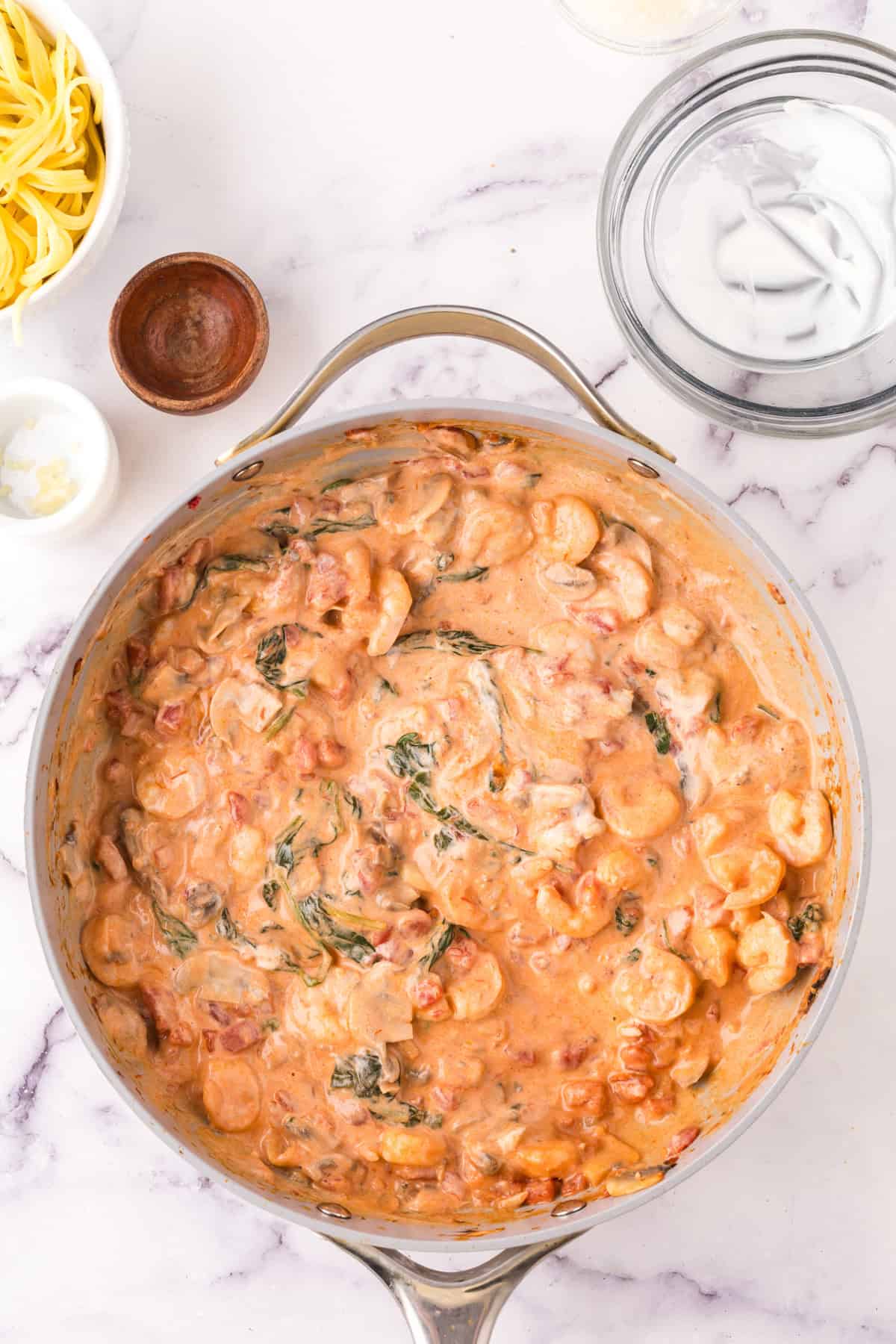 linguini rosa with shrimp in a large pot.