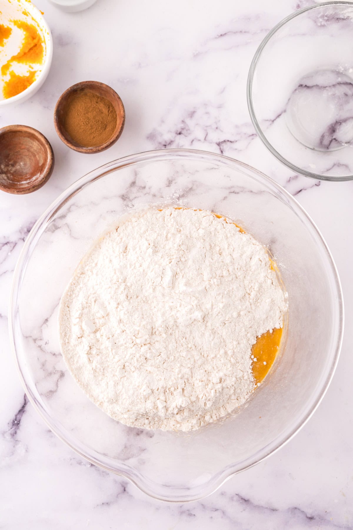 Flour added to the large mixing bowl.