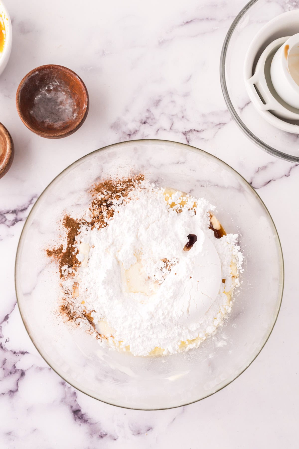 Ingredients for cinnamon roll filling in a glass bowl.