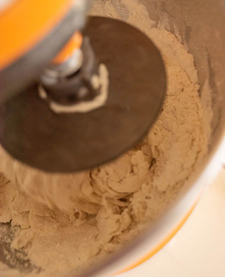 Stand mixer mixing the dough for Italian bread.