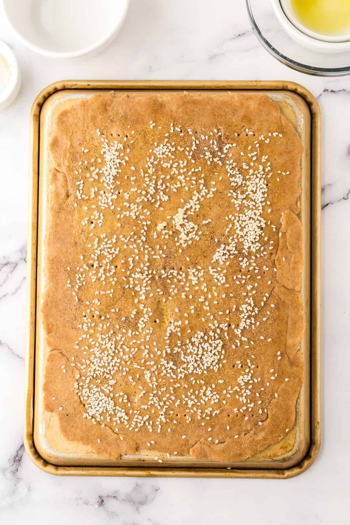 lavish bread on a baking dish.