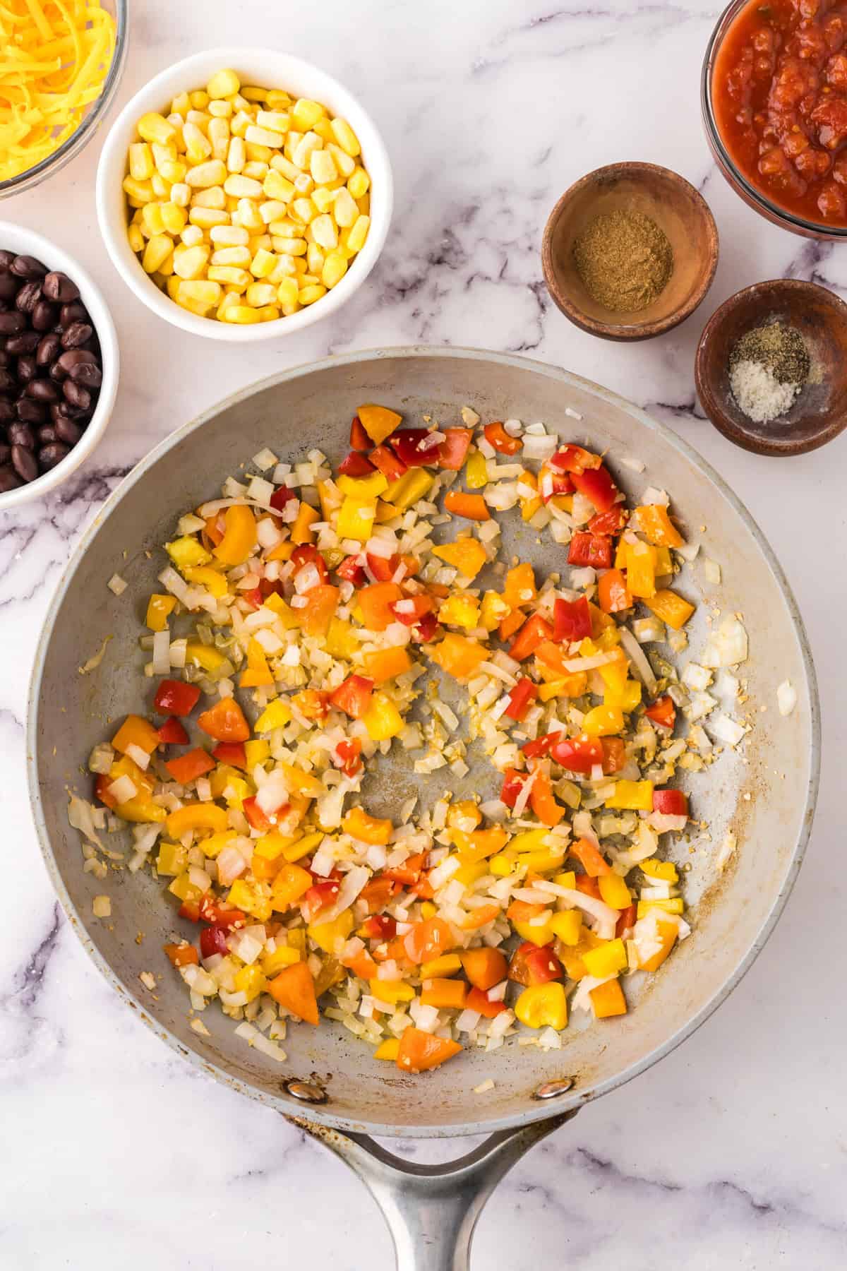 pot with sautéed ingredients to make slow cooker stuffed bell peppers.