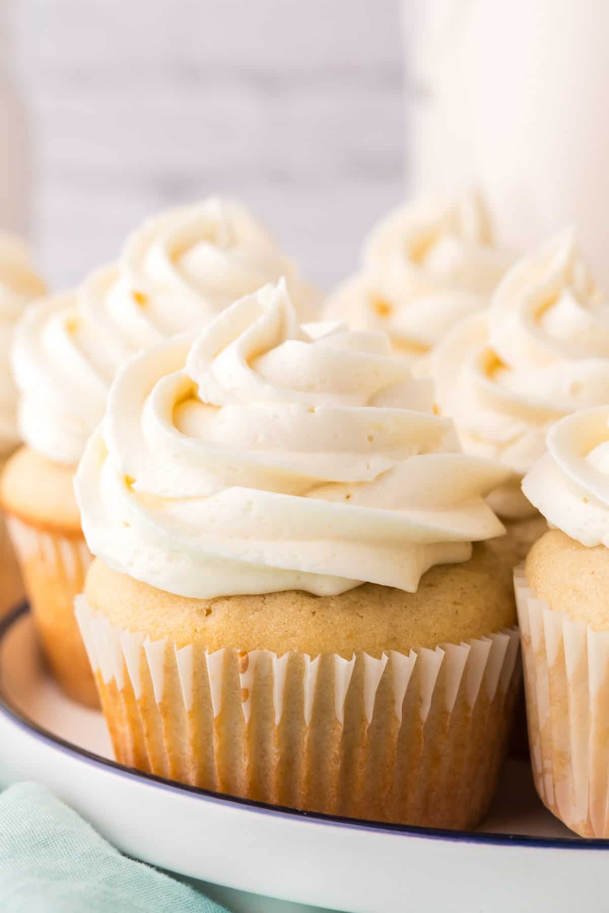 a round plate of copycat vanilla cupcakes.