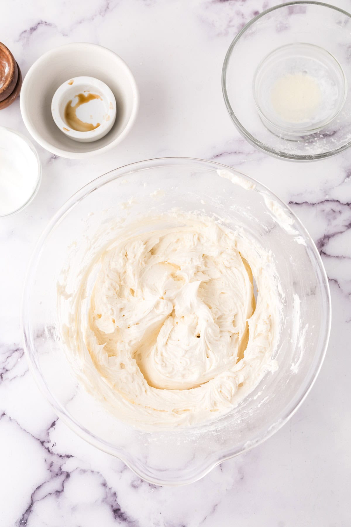 clear mixing bowl in the process of making vanilla cupcakes.