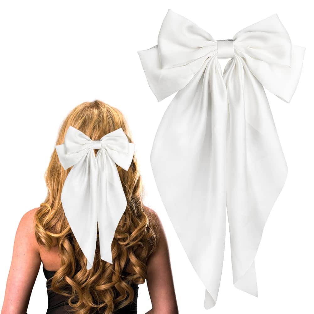 A person with long, wavy blonde hair is wearing a large white bow at the back. Another white bow is displayed separately, showcasing its size and design.