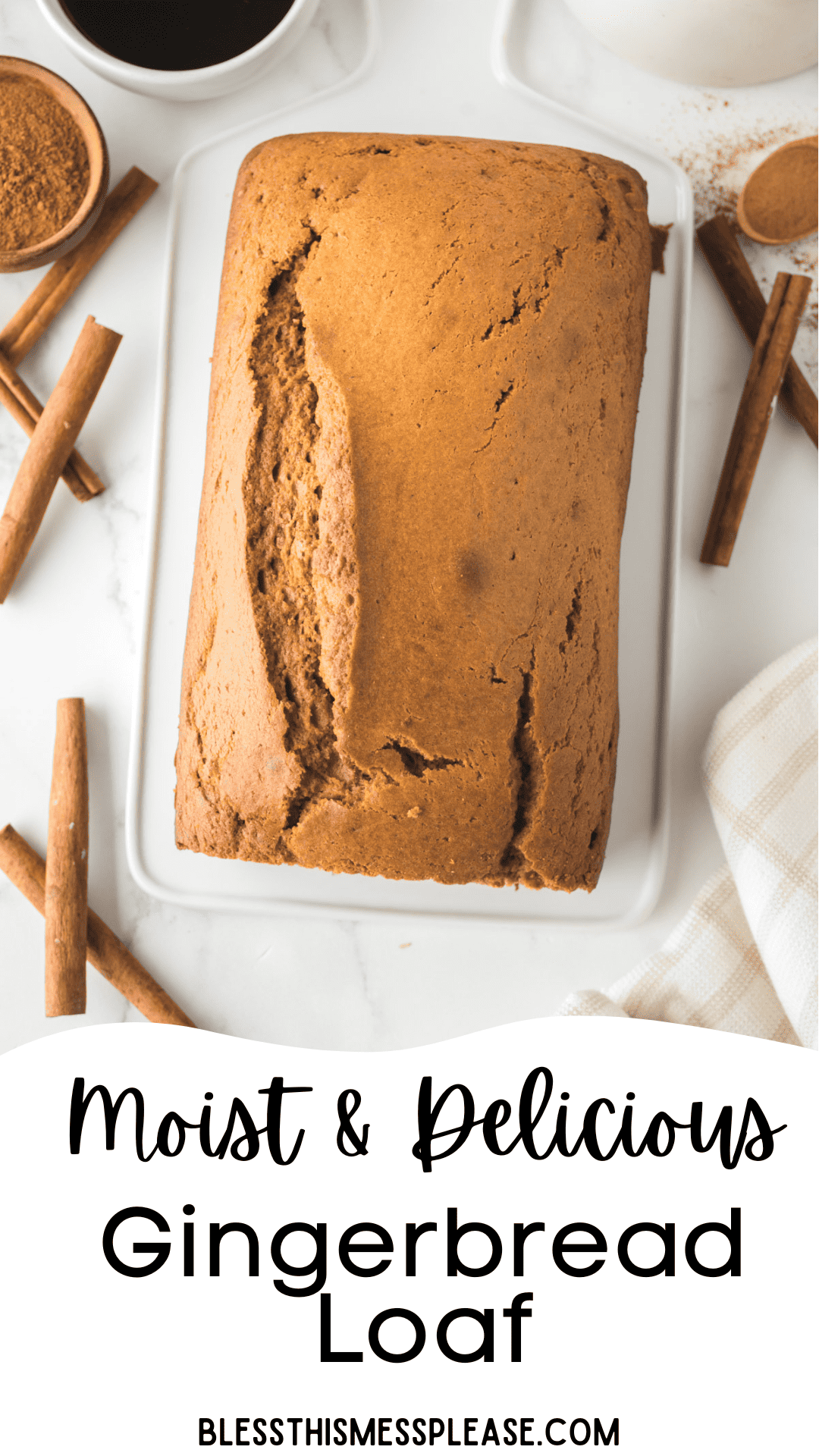 A loaf of gingerbread on a white tray, surrounded by cinnamon sticks and a small bowl of spices. The text reads Moist & Delicious Gingerbread Loaf.