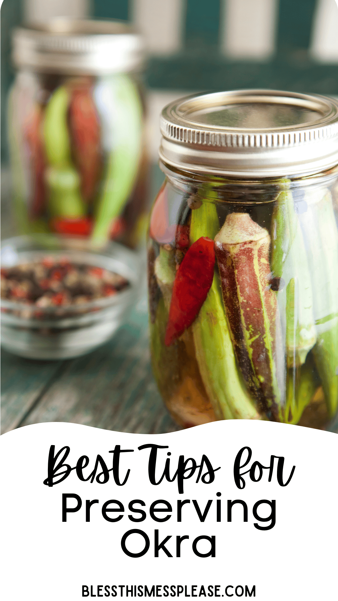 A close-up of glass jars filled with pickled okra, red chili peppers, and spices on a rustic surface. Text on image reads: Best Tips for How to Preserve Okra